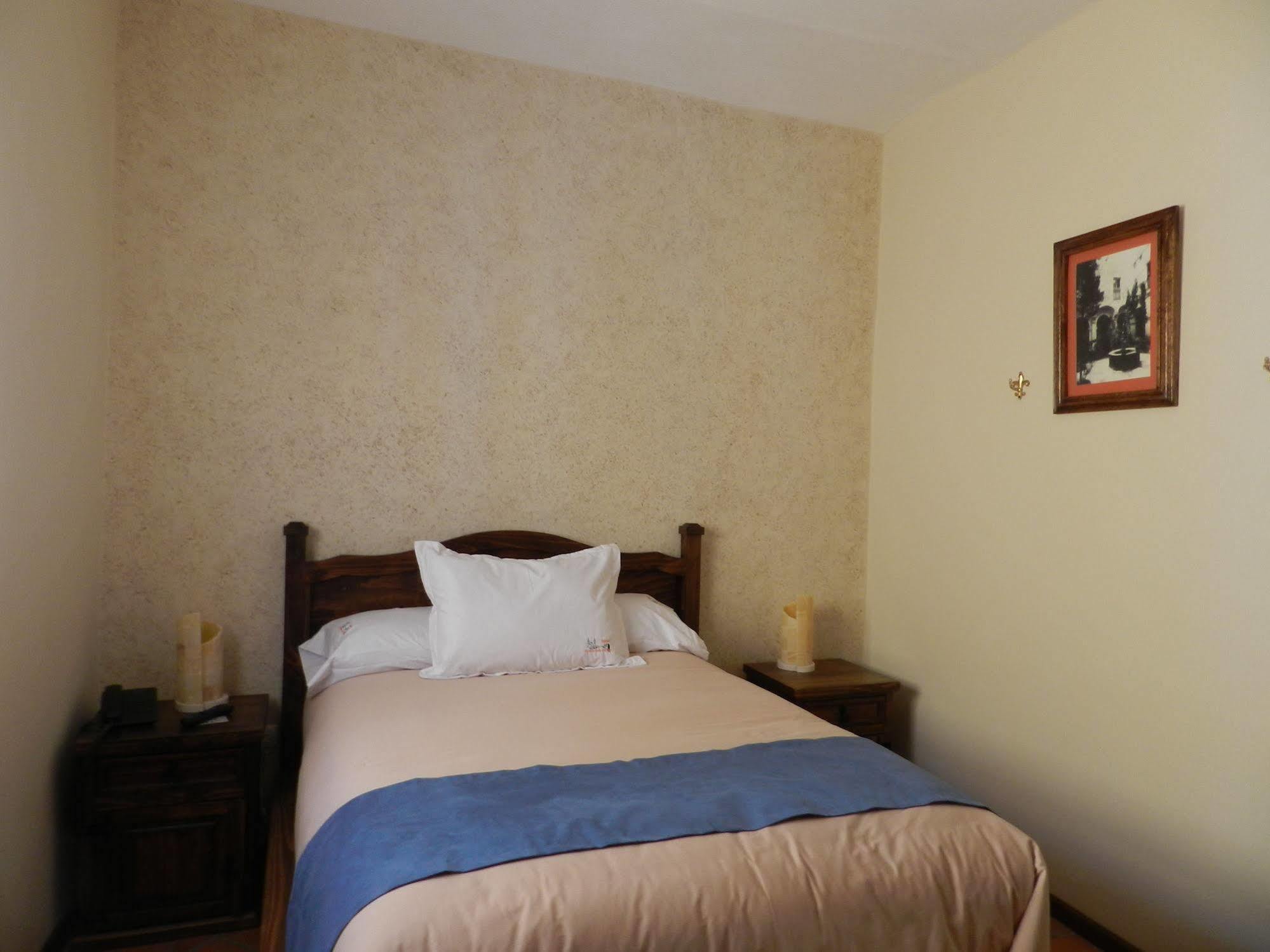 Collection O Al Otro Lado Del Rio, Puebla Ξενοδοχείο Εξωτερικό φωτογραφία A bedroom at the hotel